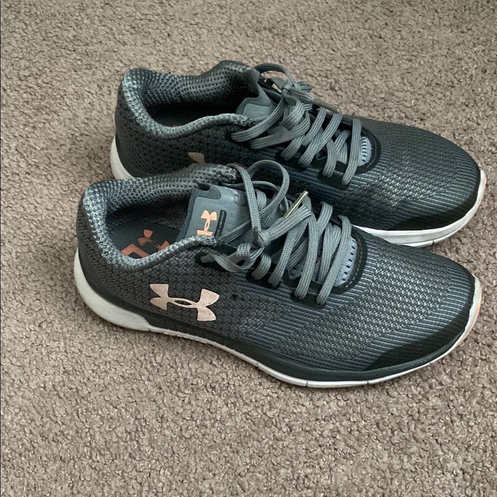 Under Armour Charcoal and White Running Shoes.  Only use two times my feet grow